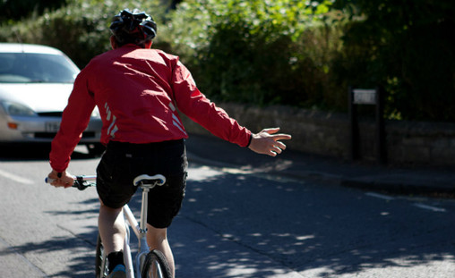 The right hand signal is legally required communication for bike riders in Australia