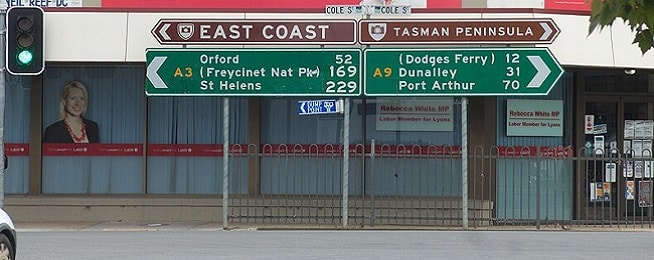 Road sign at the intersection of Cole Street Sorell and the Tasman Highway, which lists Dodges Ferry as one of the destinations.