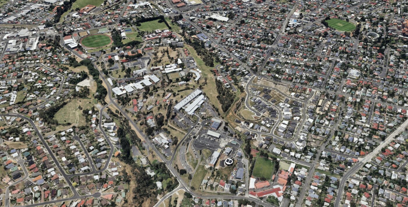 Aerial view of St Johns Park, showing the sports precinct and Lenah Valley Primary School.