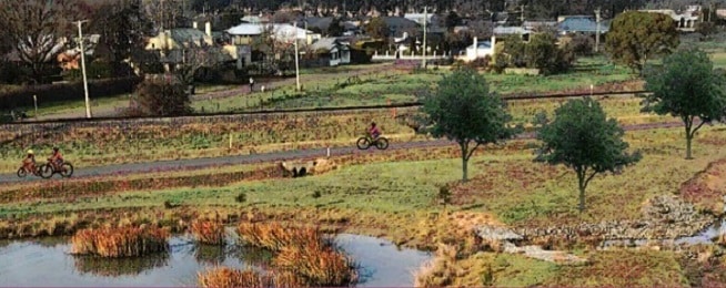 An artist impress of what the Youl Road shared pathway will look like with cyclists riding along it.