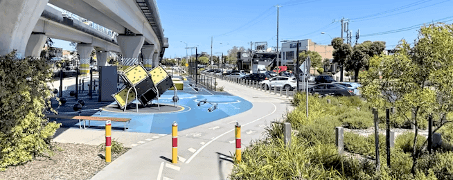 The current bike path at Clayton Station which runs under the elevated train lane.